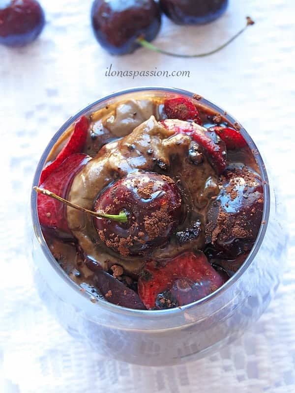 Healthy and naturally sweeten avocado chocolate mousse topped with cherries by ilonaspassion.com
