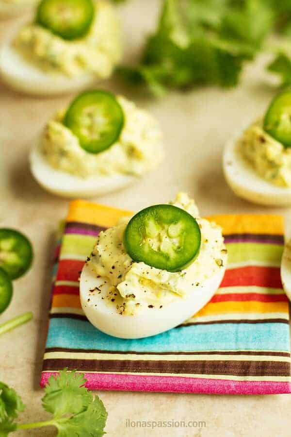 Hard boiled eggs cut in half and topped with mayo filling.