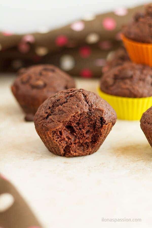 A bite of the double chocolate chip muffins made with simple ingredients that you already have at home!  by ilonaspassion.com I @ilonaspassion