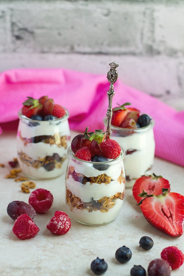 Yogurt parfait with berries and frozen grapes.