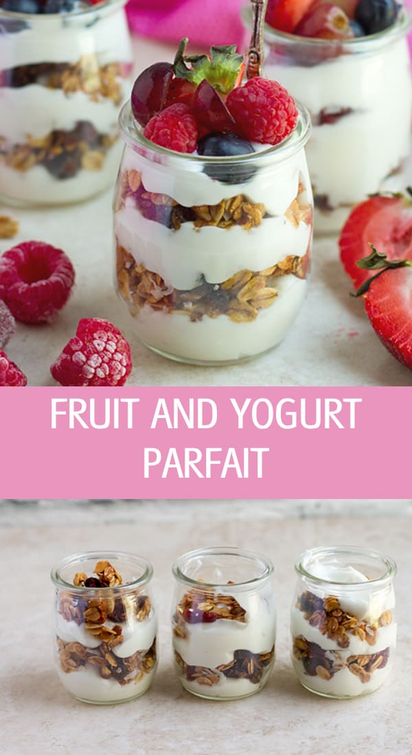 Fruit and yogurt parfait with frozen grapes, granola and berries.