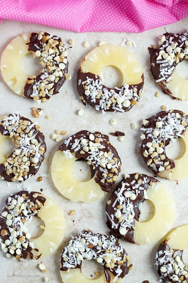 Pineapple rings dipped in ganache and sprinkled with walnuts.