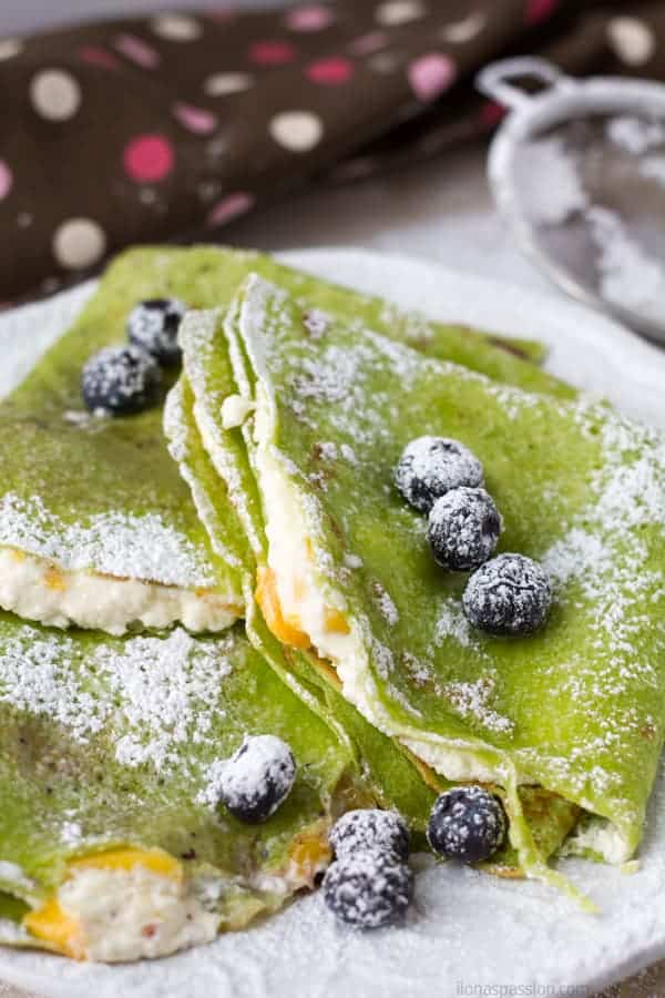 Sweet crepes filled with cottage cheese or farmer's cheese and topped with mango.