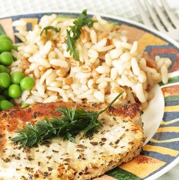 Lemon Basil Pork Chop - Marinated in lemon and basil pork chop is grilled to perfection. Healthy, lemony pork chop is perfect for everyday dinner. Served with rice and green peas by ilonaspassion.com I @ilonaspassion