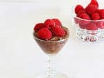 Healthy, no refined sugar chocolate mousse topped with raspberries by ilonaspassion.com