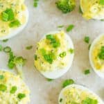 Deviled eggs with mustard, yolks and veggie.