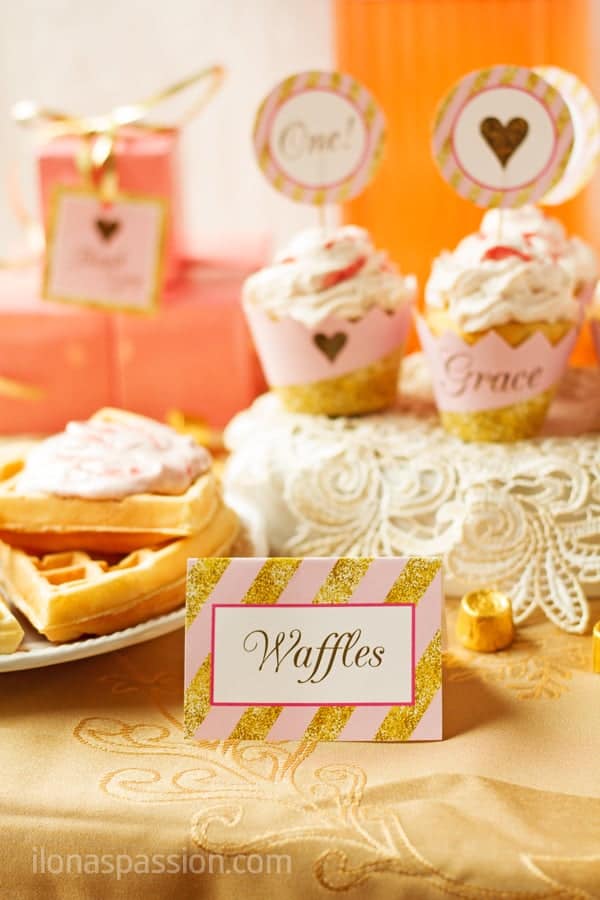 Waffles served for baby girl 1st birthday party with table tent.
