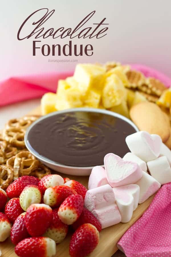Chocolate fondue with marshmallows, strawberries, pineapple, pretzels.