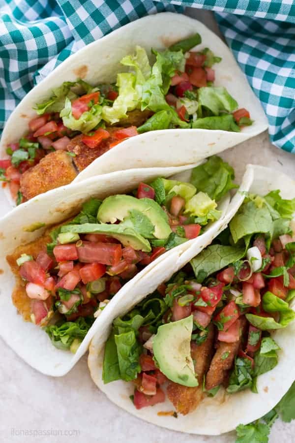 Best fish taco recipe made with white fish and dipped in bread crumbs. Served with taco toppings by ilonaspassion.com I @ilonaspassion