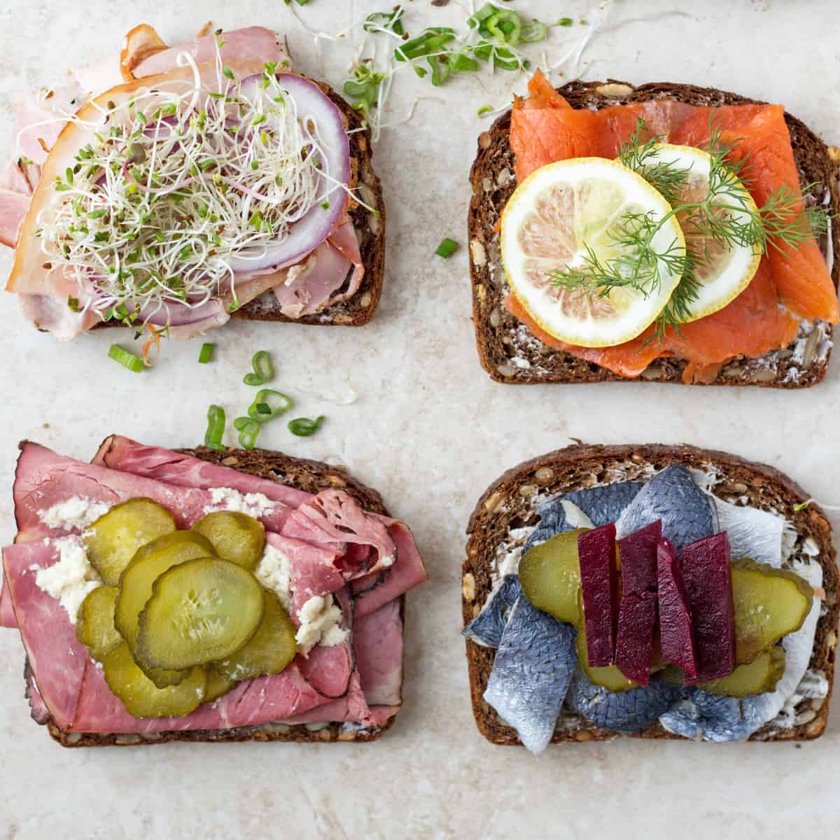 Scandinavian traditional sandwiches with meat and fish topped with pickles, roasted beets and lemon by ilonaspassion.com I @ilonaspassion