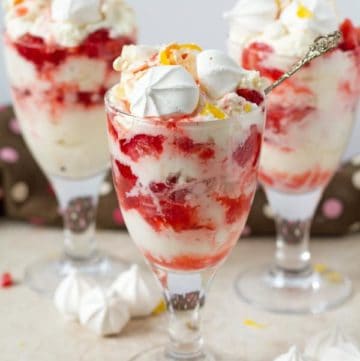 Eton mess with summer fruit served in 3 jars.