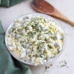 Veggie and egg salad topped with parsley.