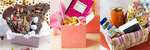 Chocolate bark in a box, basket with pasta and pink box goodie bag as gift ideas.