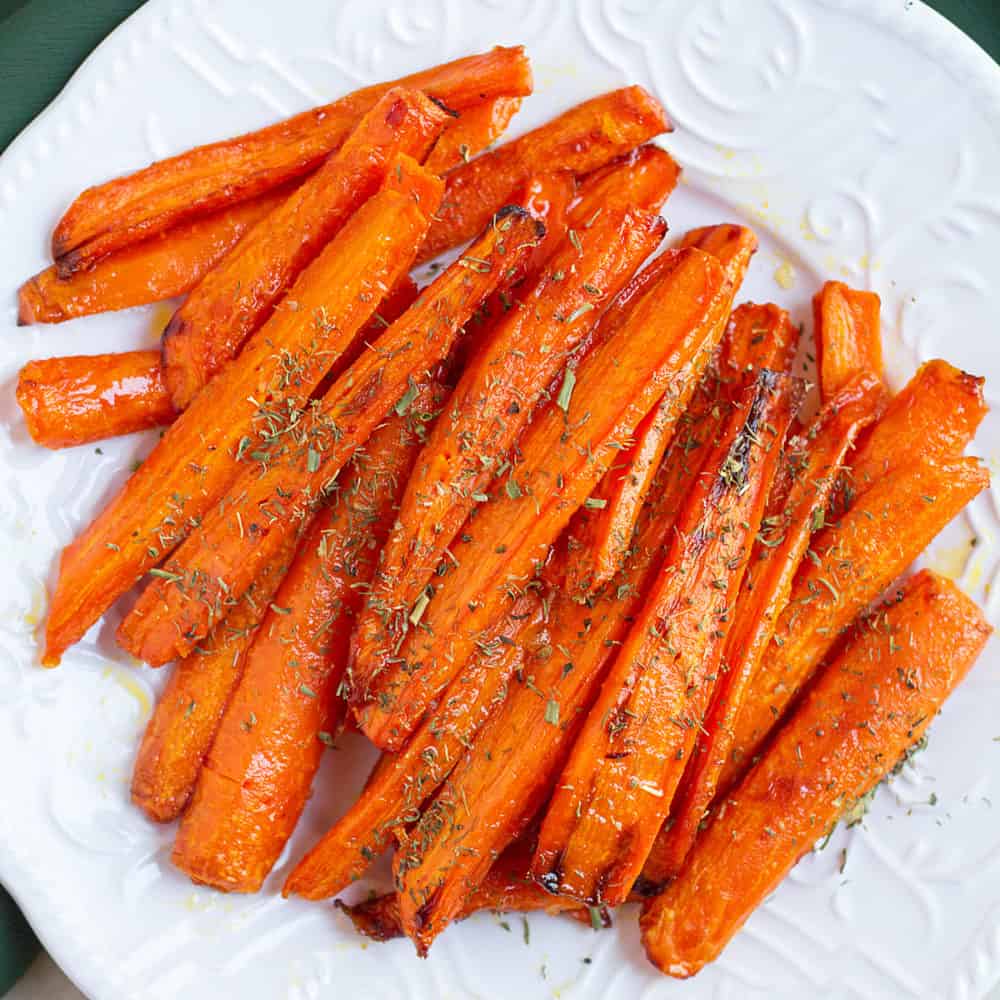 Cooked carrots on a plate.