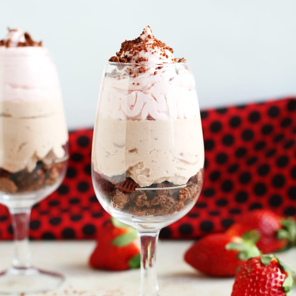 Three layers of mousse: cookie crumbs, chocolate and strawberry.
