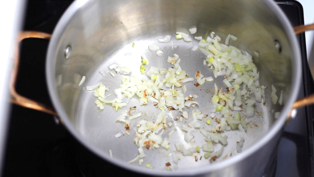 Cooking Chopped onion on frying pan.
