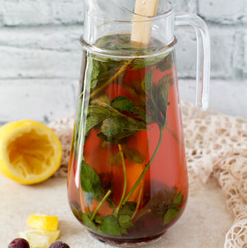 Lemonade with mint and cherries.