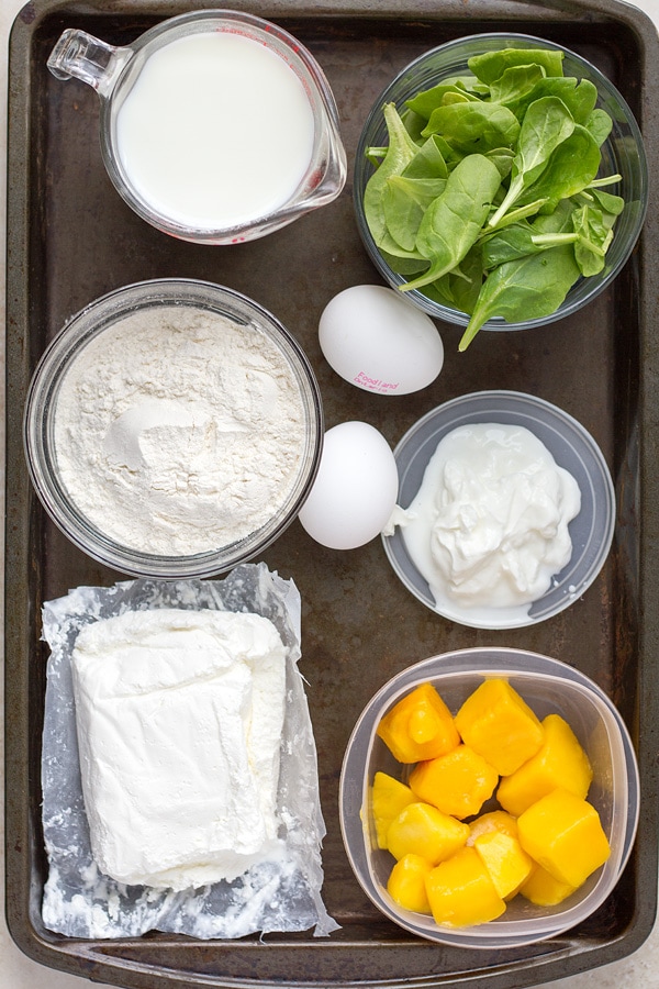Spinach, milk, flour, eggs, greek yogurt, diced mango.