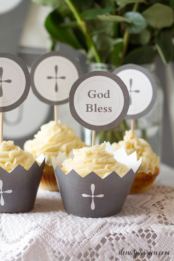 Communion cupcakes with printable grey wrappers with cross image.
