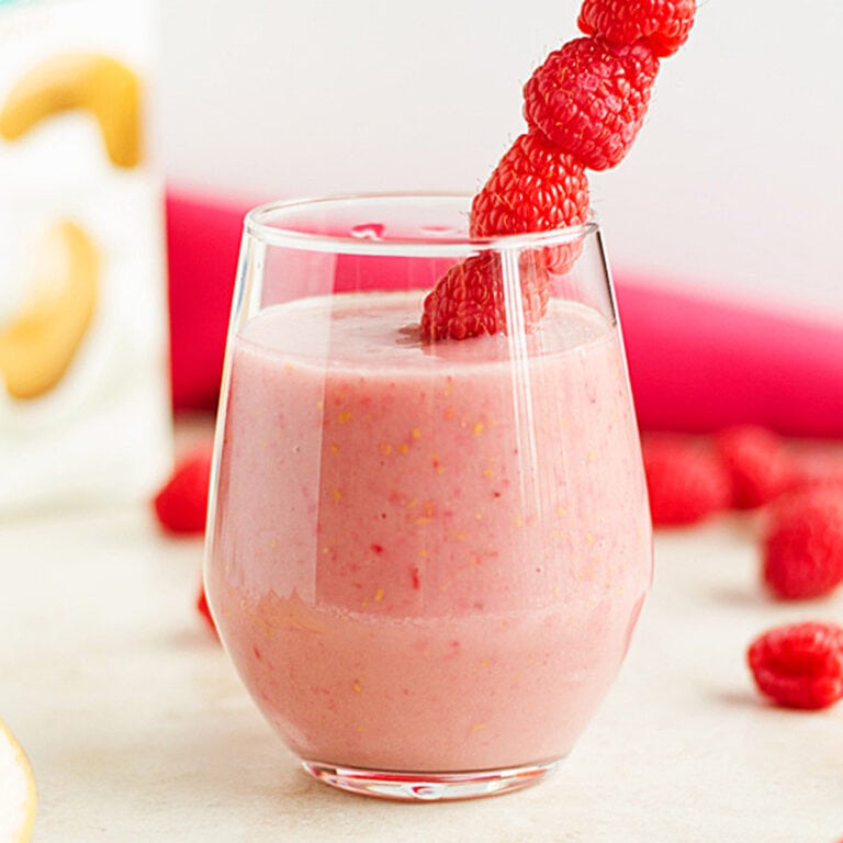 Smoothie with fresh banana and raspberries.