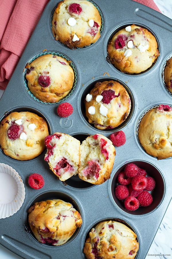 Baked muffins with berries on a baking sheet.