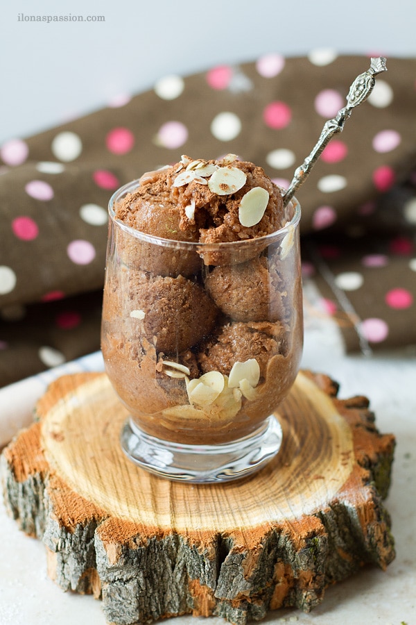 Almond milk ice cream with chocolate and banana in a glass.