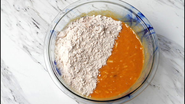 Pumpkin pure and flour in a bowl.