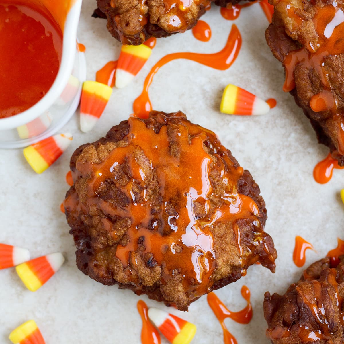 Candy corn glaze on fried fritters.