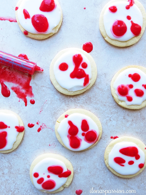 Sugar cookies with glaze and blended raspberries.