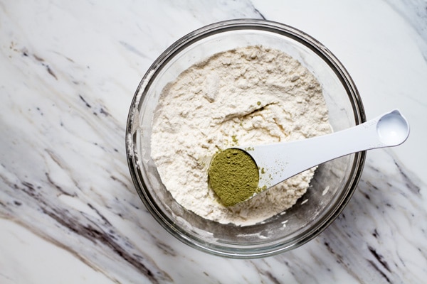 Matcha and flour in a bowl.