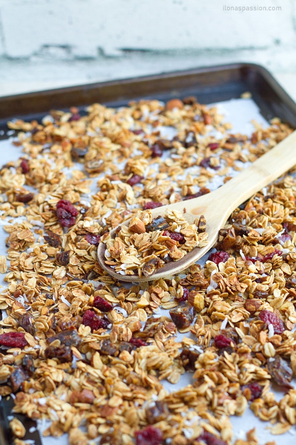 Baked oats with nuts on baking sheet.