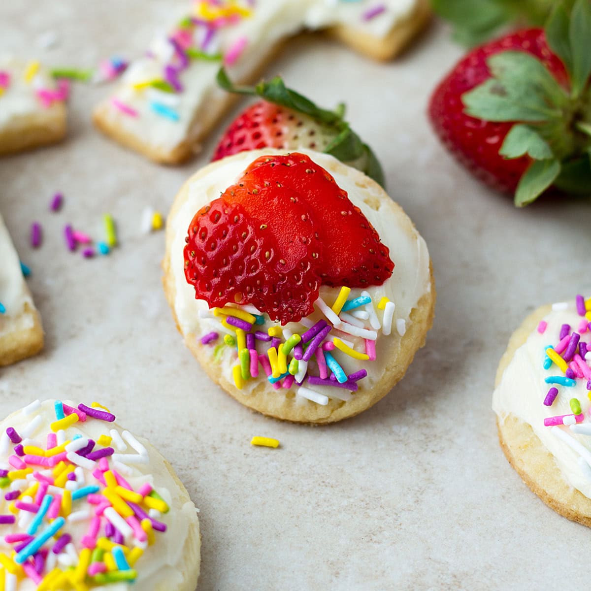 Soft buttery cookies with cream cheese, strawberry and sprinkles.