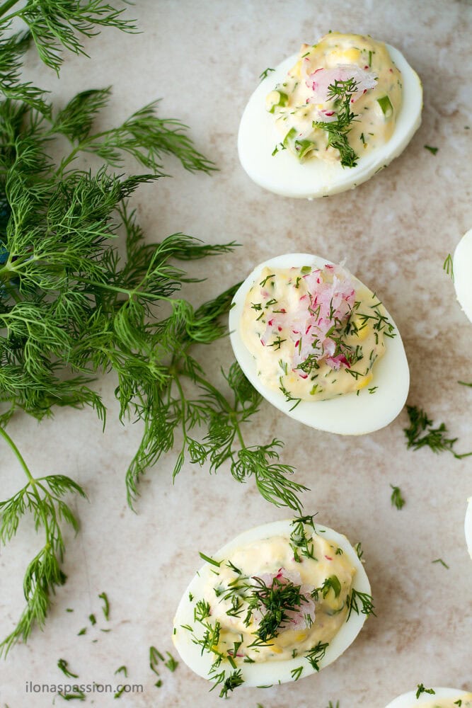 Fresh dill with deviled eggs on the side.