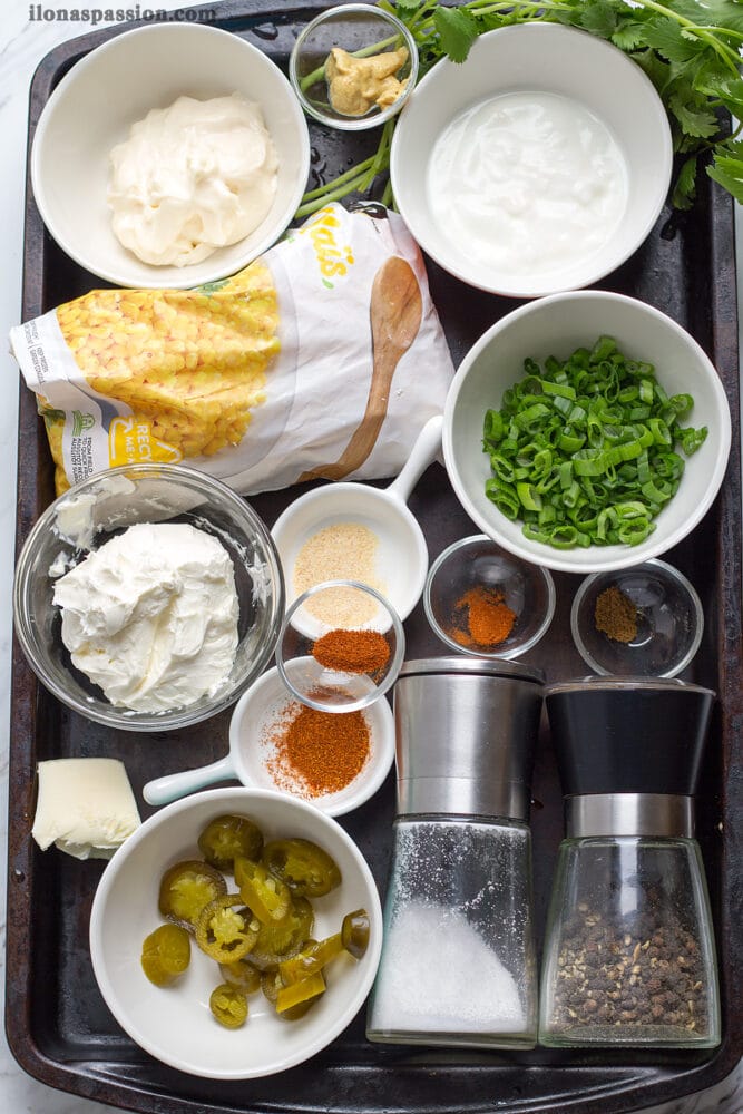 Corn, mayo, Greek yogurt, cream cheese cilantro, chive, spices, jalapeno.