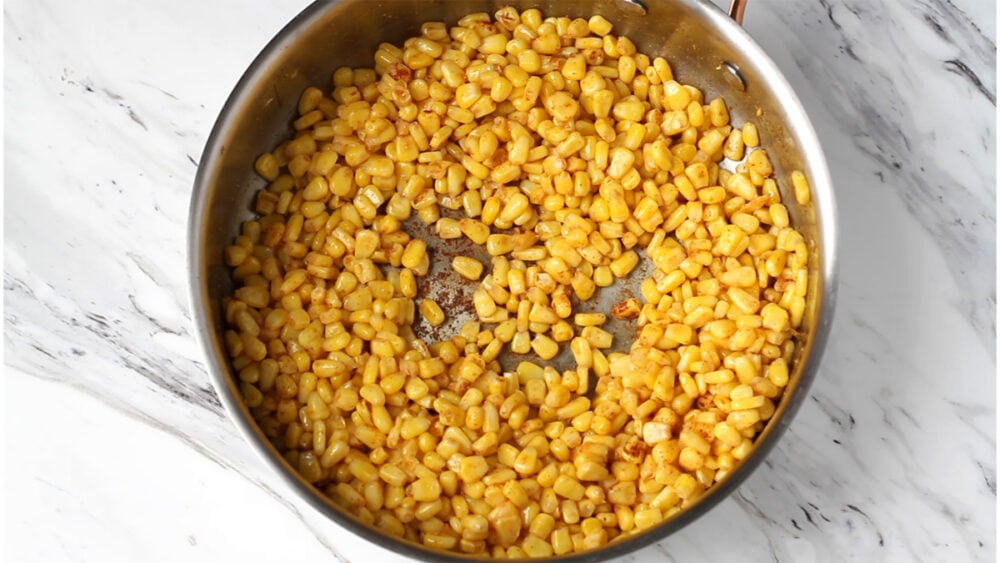 Corn with spices in a pot.